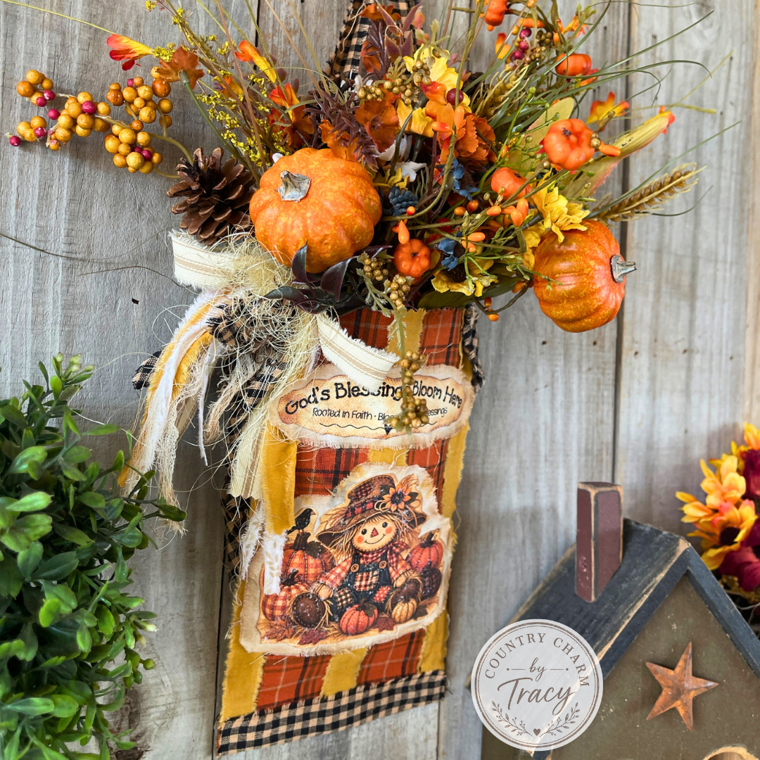 Side view of homespun fall scarecrow floral pocket with layered fabric and autumn florals