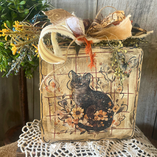 Hey Boo black shorthair kitty 6x6 wood block decor with whimsical cat wildflower butterfly artwork distressed aged wood background gold scroll cream ribbon bow rusty jingle bells and hey boo tag by Country Charm by Tracy