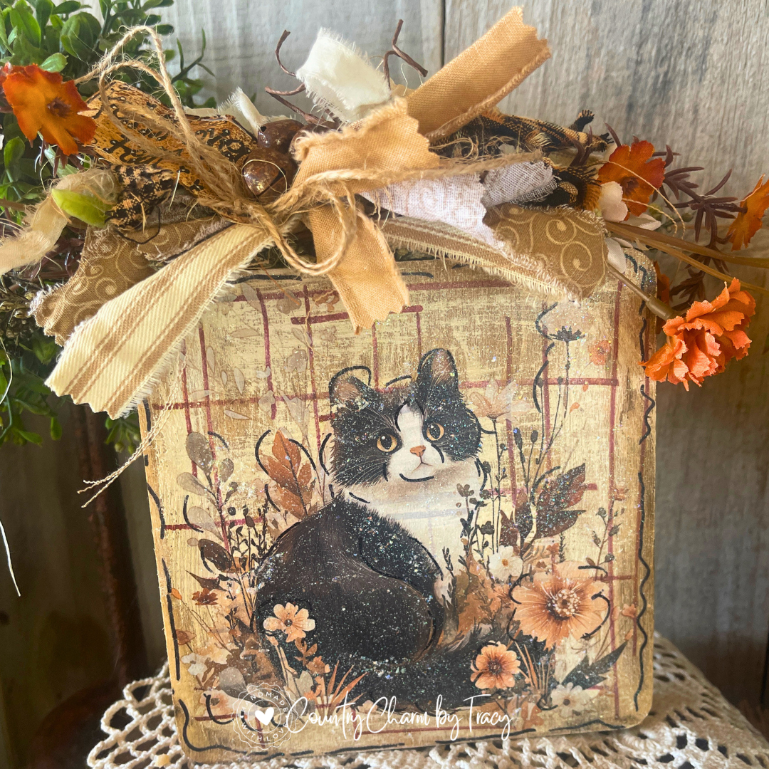Faith Over Fear fluffy tuxedo kitty 6x6 wood block decor with whimsical black and white cat wildflower artwork distressed aged wood background gold scroll cream ribbon bow rusty jingle bells and faith over fear tag by Country Charm by Tracy