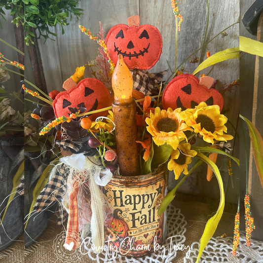 Happy Fall tin can decor with three felt jack-o'-lantern pumpkins, primitive candle, sunflowers and homespun bow